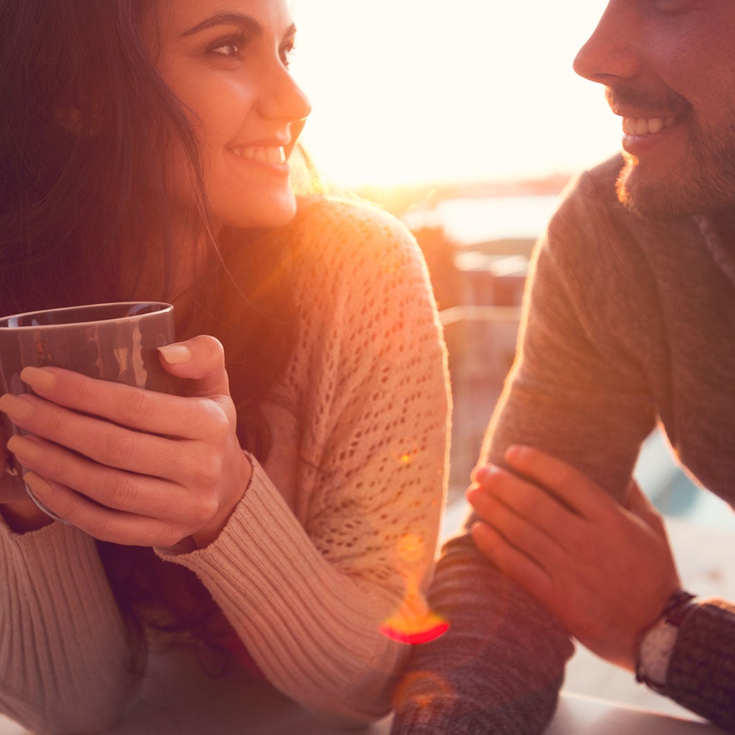 Couple talking and drinking coffee