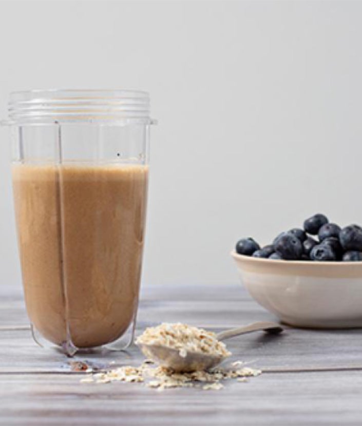 smoothies with whole blueberry on tabletop