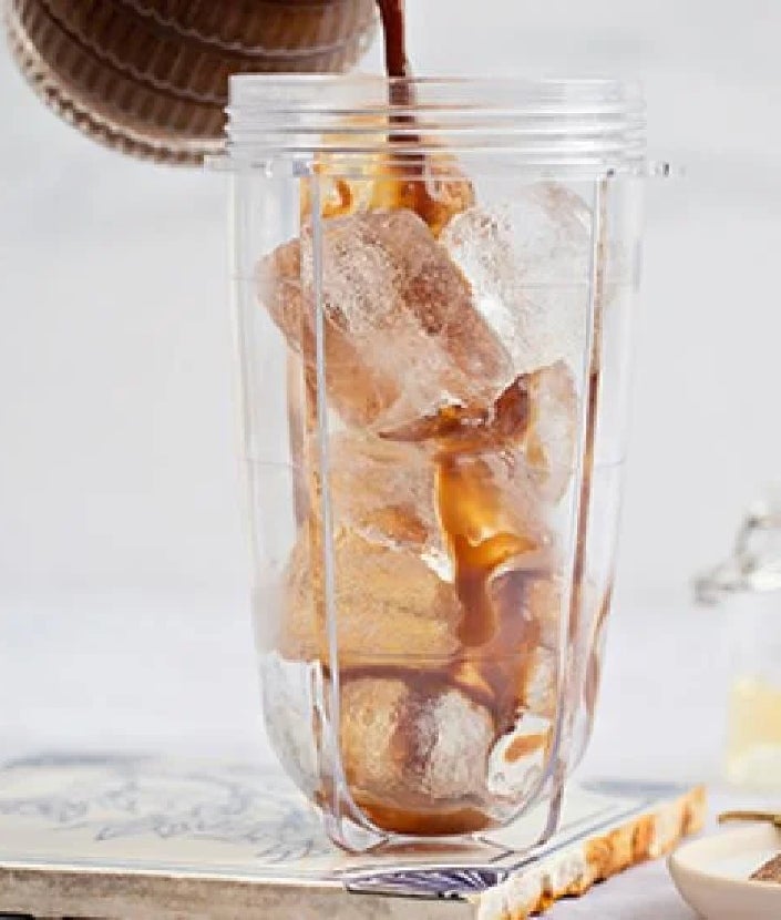 pouring coffee into blender with ice cubes