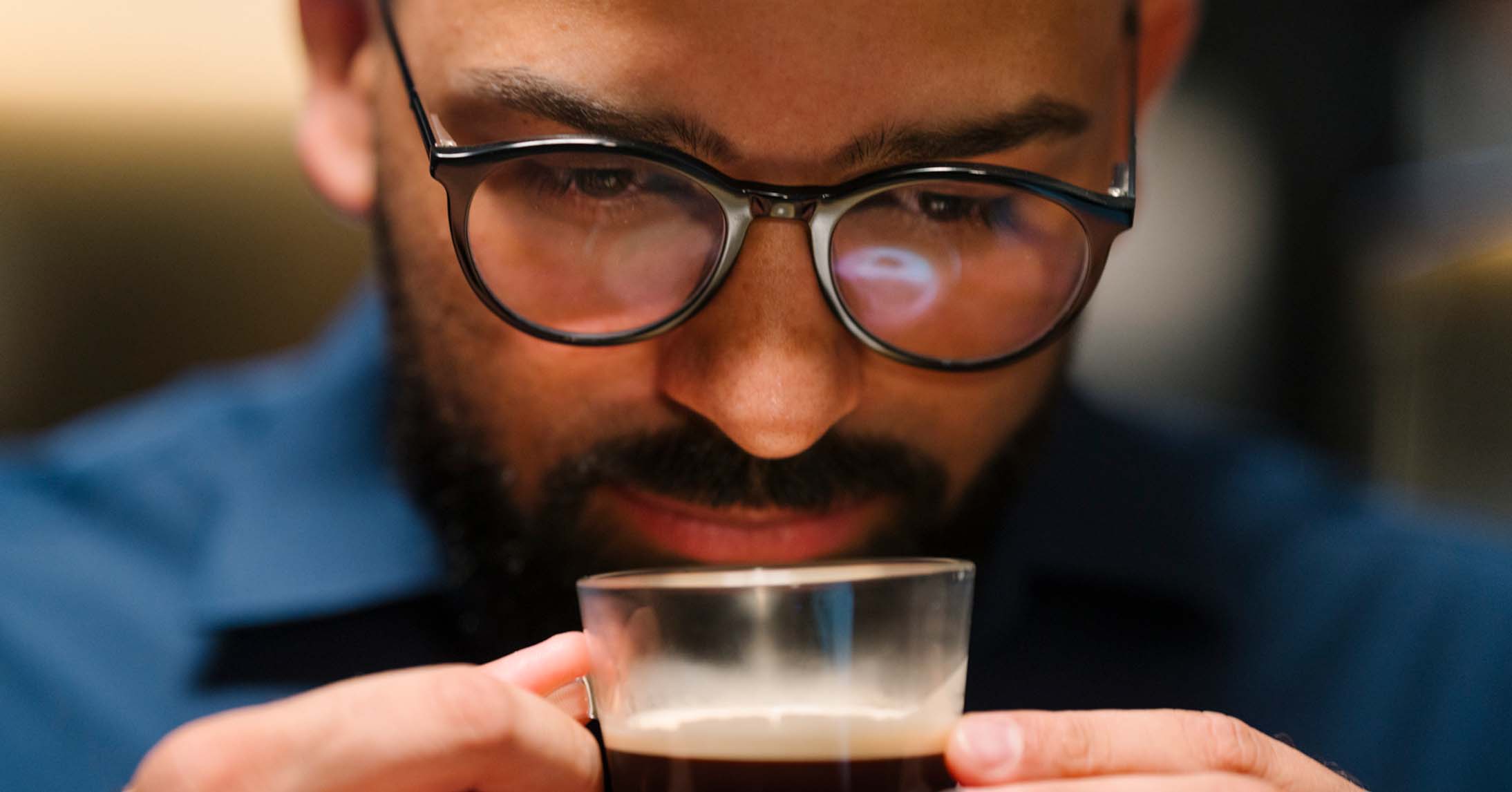 barista smelling coffee