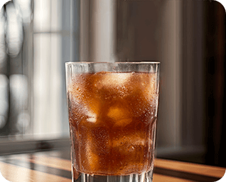 Glass filled with ice coffee.