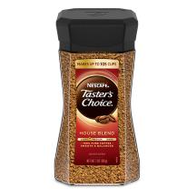 A jar of Taster’s Choice House Blend instant coffee with a black lid and coffee beans near the Taster's Choice logo.