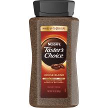 A jar of Taster’s Choice House Blend instant coffee with a black lid and coffee beans near the Taster's Choice logo.